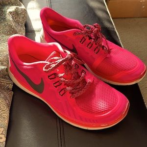 Hot pink Nike sneakers